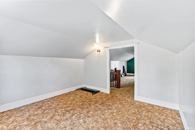 bonus room featuring lofted ceiling and carpet floors