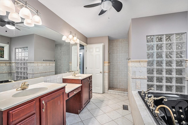 bathroom featuring ceiling fan, shower with separate bathtub, vanity, and tile patterned floors