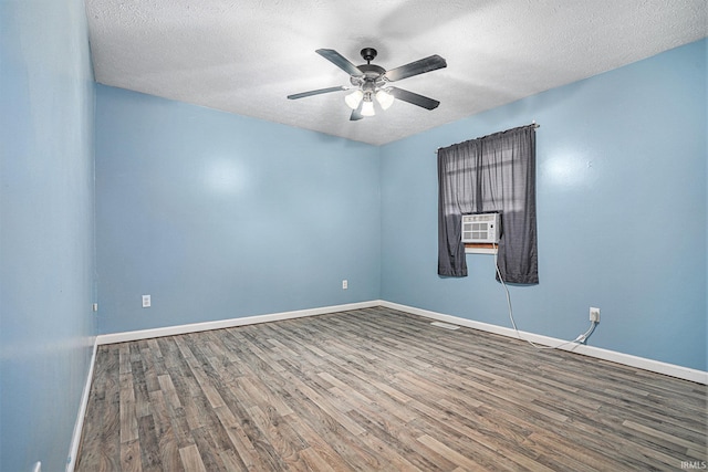 spare room featuring ceiling fan, hardwood / wood-style flooring, and a textured ceiling