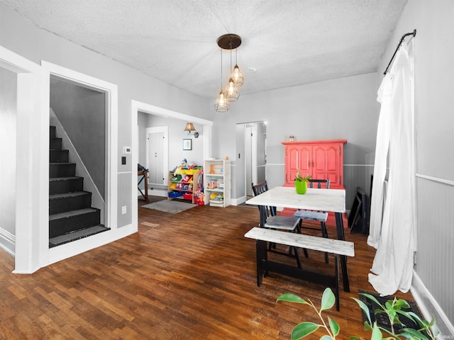 playroom featuring dark hardwood / wood-style floors and a textured ceiling