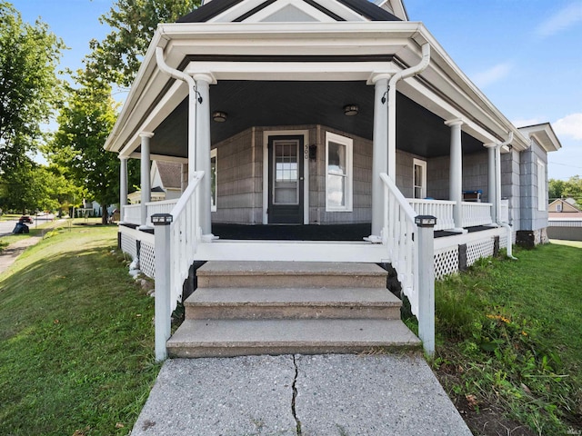 view of front of home with a front lawn and covered porch