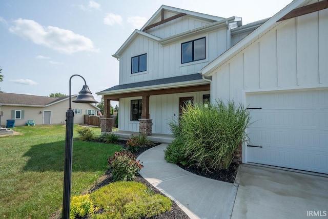 view of front of house featuring a garage and a front lawn