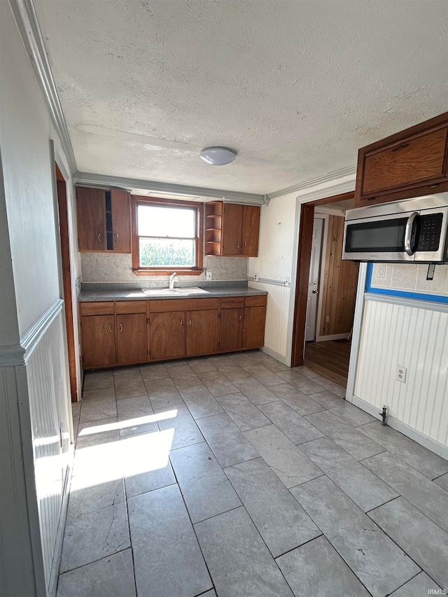 kitchen with a textured ceiling and sink