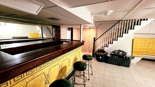 bar with light tile patterned floors