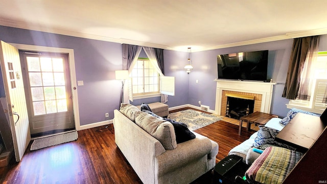 living room featuring ornamental molding, dark hardwood / wood-style floors, and a brick fireplace