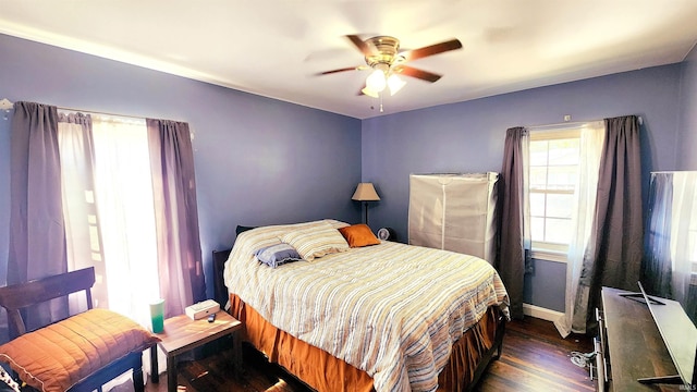 bedroom featuring ceiling fan and dark hardwood / wood-style flooring