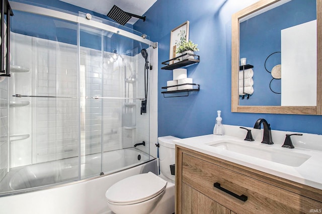 full bathroom with shower / bath combination with glass door, vanity, and toilet