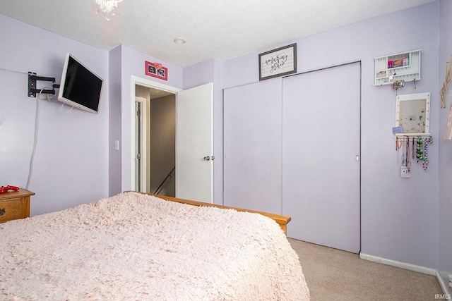 bedroom featuring a closet and carpet