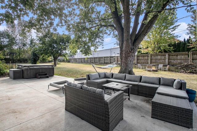 view of patio / terrace with a hot tub and outdoor lounge area