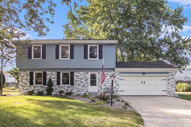 view of front of home featuring a garage and a front yard