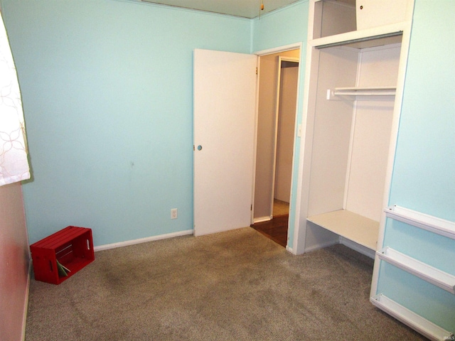 unfurnished bedroom featuring a closet and carpet flooring