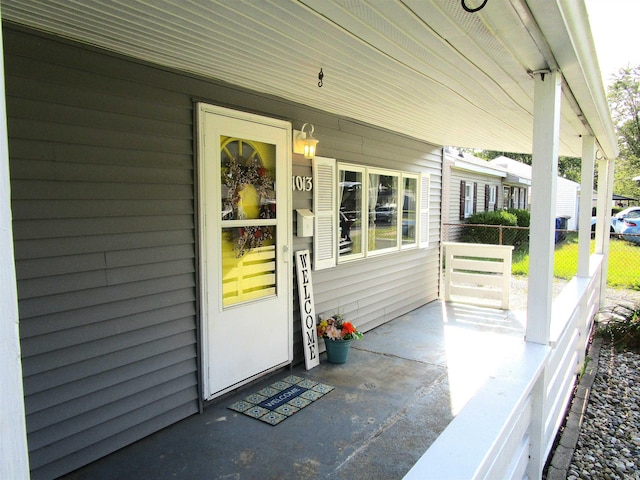 property entrance featuring covered porch