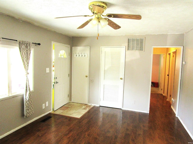 entrance foyer with ceiling fan and dark hardwood / wood-style floors