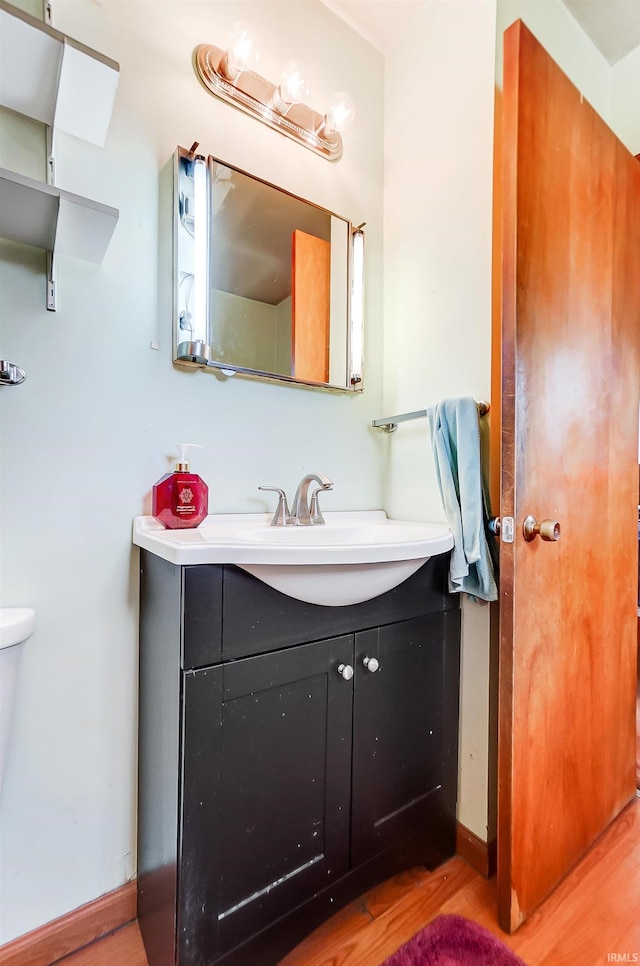 bathroom featuring hardwood / wood-style floors and vanity