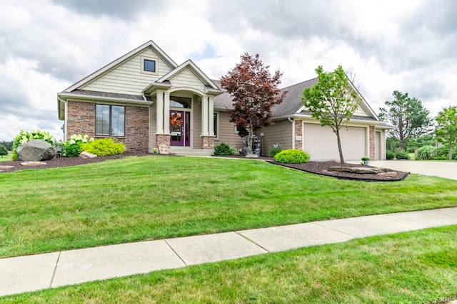 craftsman inspired home featuring a garage and a front yard