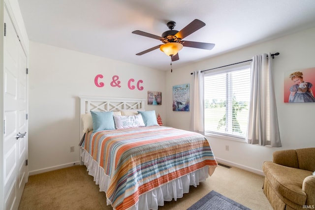 carpeted bedroom with ceiling fan