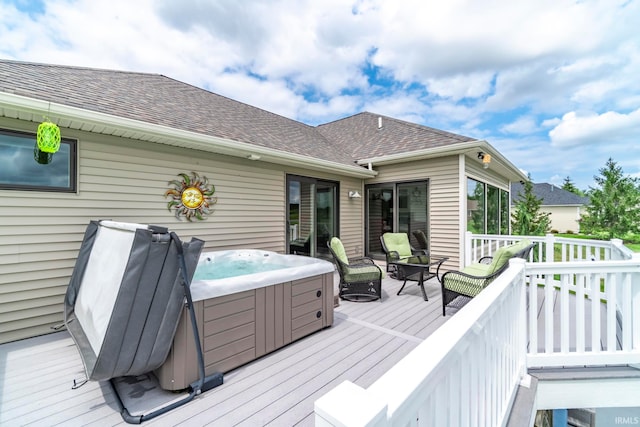 deck featuring a hot tub