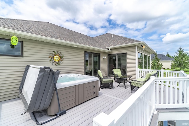 wooden terrace with a hot tub