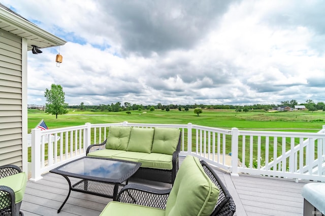 deck featuring a yard and outdoor lounge area