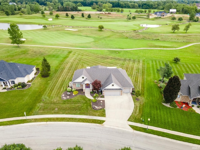drone / aerial view featuring a water view and view of golf course