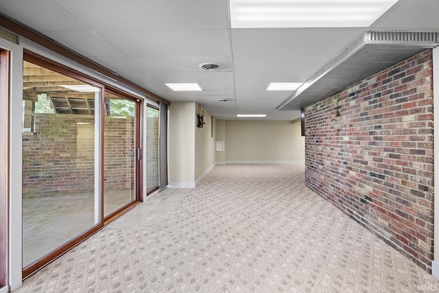 interior space featuring a drop ceiling