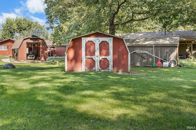 view of outdoor structure featuring a lawn