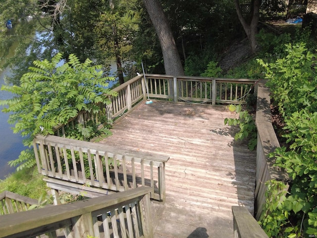 wooden deck with a water view