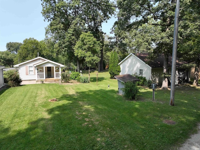 view of yard with covered porch