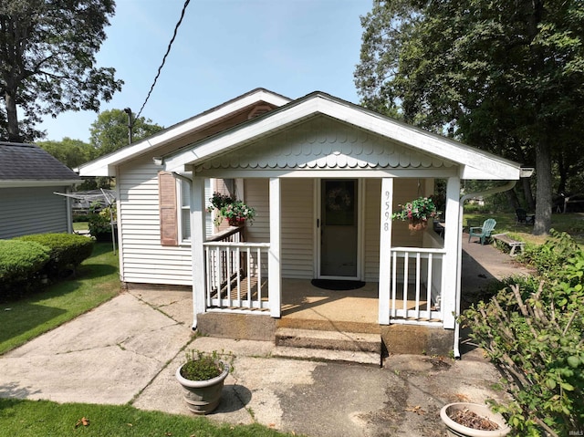 exterior space featuring covered porch and a patio area