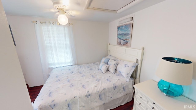 bedroom with ceiling fan and dark hardwood / wood-style floors