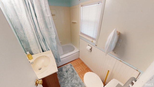 full bathroom featuring vanity, toilet, shower / tub combo, and parquet flooring