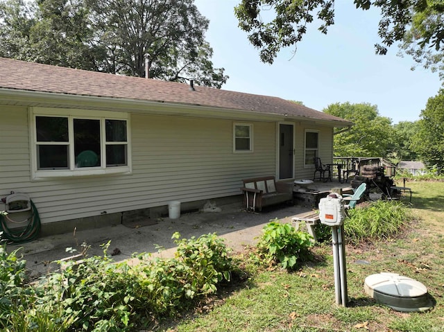 rear view of property featuring a patio