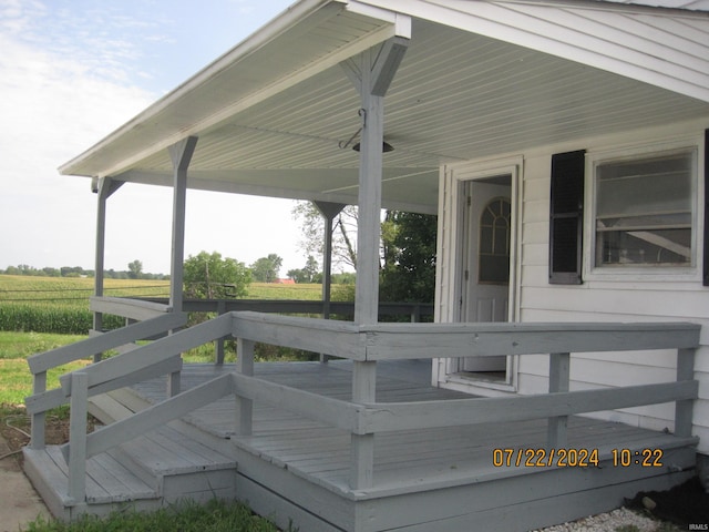 wooden deck featuring a rural view