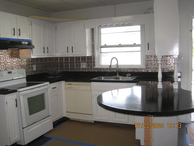 kitchen with white cabinetry, white appliances, sink, decorative backsplash, and ventilation hood