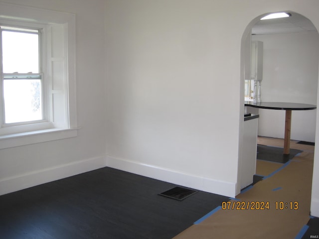 empty room featuring wood-type flooring