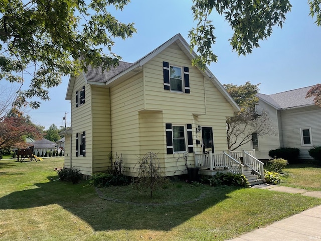 bungalow-style house with a front lawn