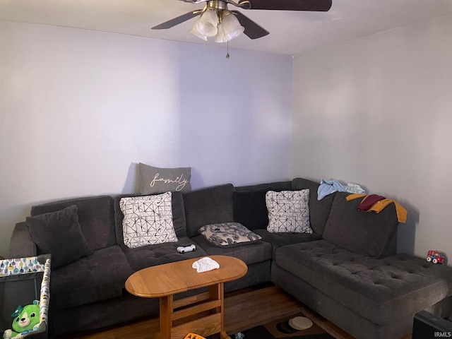 living room featuring ceiling fan and hardwood / wood-style flooring