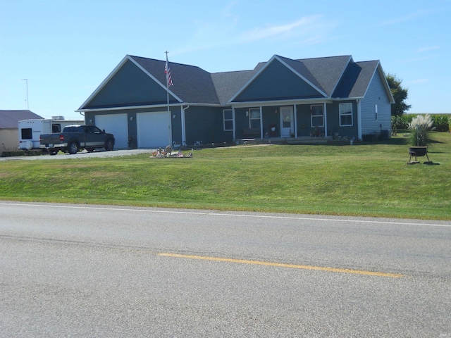 single story home featuring a garage, a porch, and a front yard