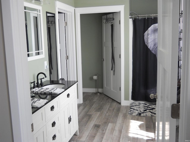 bathroom with wood-type flooring and vanity