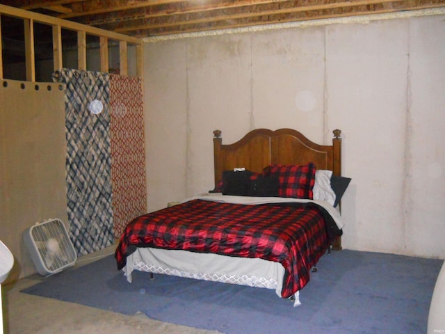 bedroom featuring concrete floors