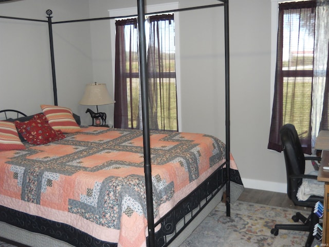 bedroom with hardwood / wood-style floors