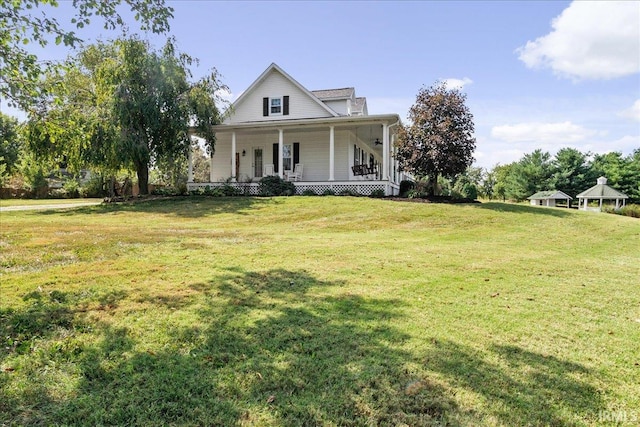 country-style home featuring a front lawn and a porch