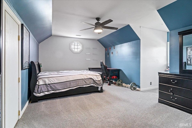 carpeted bedroom featuring lofted ceiling and ceiling fan