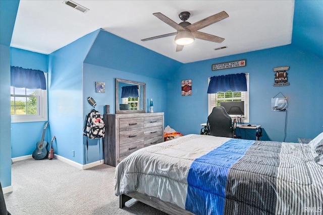 bedroom with lofted ceiling, ceiling fan, and carpet