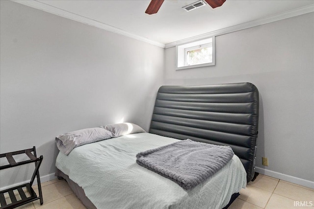 bedroom featuring crown molding, light tile patterned floors, and ceiling fan