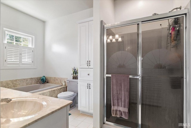 full bathroom featuring vanity, toilet, independent shower and bath, and tile patterned floors