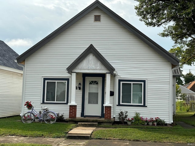 bungalow with a front lawn