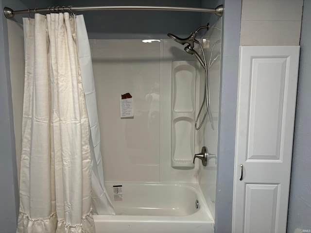 bathroom featuring shower / tub combo with curtain