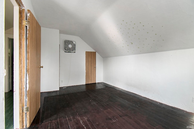 bonus room with lofted ceiling and hardwood / wood-style flooring