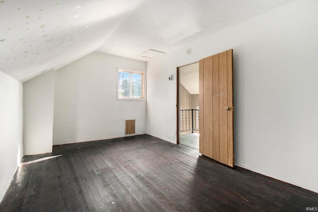 bonus room with lofted ceiling and dark hardwood / wood-style floors